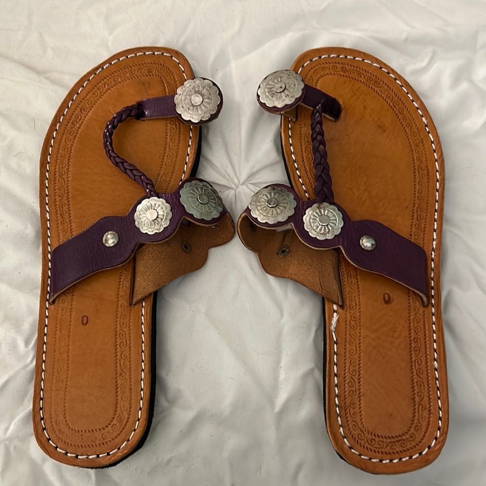 Purple leather flip flops